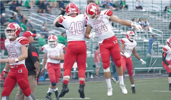  ?? WORSOM ROBINSON/FOR THE SUN-TIMES ?? Marist’s Jake Duerr (40) and Colin Bohanek (44) will be fired up when the No. 12 RedHawks challenge No. 3 Nazareth on Friday.