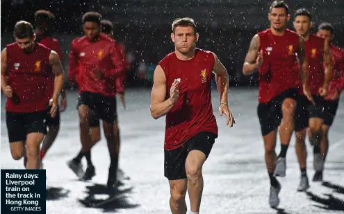  ?? GETTY IMAGES ?? Rainy days: Liverpool train on the track in Hong Kong