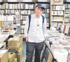  ?? — AFP photo ?? Lam poses for a photo at a book store in Taipei.
