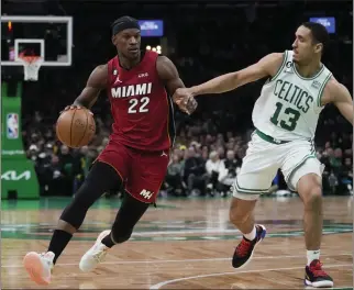  ?? CHARLES KRUPA – THE ASSOCIATED PRESS ?? The Heat’s Jimmy Butler drives to the basket against the Celtics’ Malcolm Brogdon in Wednesday’s game.