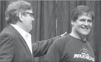  ?? THE ASSOCIATED PRESS ?? In a Thursday, Aug. 15, file photo, Dallas Mavericks owner Mark Cuban, right, gets a pat on the back from president of basketball operations Donn Nelson before a news conference, in Dallas. The government’s insider-trading case against Cuban goes to...