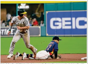  ?? RICHARD CARSON / ASSOCIATED PRESS ?? Oakland’s Boog Powell (left) looks as he advances on an Alex Bregman throwing error as Houston’s Jose Altuve hits the ground in the first inning of the Athletics’ victory Sunday afternoon.