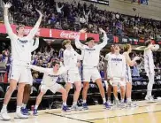  ?? Kathy Kmonicek/Associated Press ?? The Furman bench knows a trip to the NCAA Tournament is all but in the bag Monday night.