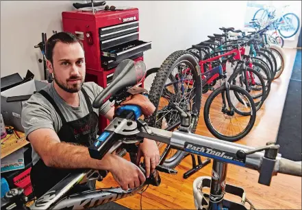  ?? SEAN D. ELLIOT/THE DAY ?? Apollo Ziembroski poses Friday in the showroom of his new Apollo Cycle Shop on Franklin Street in Norwich. The shop will have a grand opening next Friday.