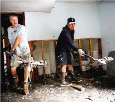  ??  ?? People clean their house after the passing of Hurricane Florence in New Bern. — Reuters photo