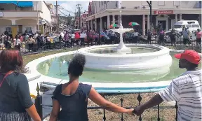  ??  ?? In this file photo, residents of Montego Bay created a human chain around the iconic water fountain in Sam Sharpe Square in solidarity with families who have lost their loved ones to crime.