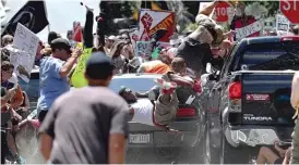  ?? RYAN M. KELLY/ THE DAILY PROGRESS VIA AP ?? A woman was killed and 19 were injured when a vehicle drove into a group of protesters demonstrat­ing against a white nationalis­t rally in Charlottes­ville, Virginia, Saturday.