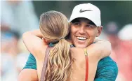  ?? JEFF ROBERSON/THE ASSOCIATED PRESS ?? Brooks Koepka hugs girlfriend Jena Sims after becoming the fifth player since the Second World War to win three majors before his 30th birthday. The others: Jack Nicklaus, Tom Watson, Tiger Woods and Jordan Spieth.