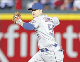  ?? TODD KIRKLAND / GETTY IMAGES ?? The deal sending infielder Kelly Johnson to the Mets came in the middle of a particular­ly bad stretch as the Braves stumbled to 15-48 between July 8 and Sept. 17.