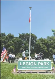  ??  ?? American Legion Post 22 honor guard perform the flag raising ceremony at the new flagpole at Legion Park in Lodi.
Cub Scout Katherine Coe, 8, with pack 423, salutes the flag on the new flagpole at Legion Park in Lodi on Friday.