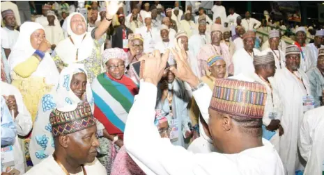  ??  ?? Gov. Ibrahim Gaidam of Yobe State acknowledg­es cheers from Yobe delegates at the APC National Special Convention in Abuja at the weekend.