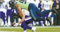  ?? AFP-Yonhap ?? Middle linebacker Bobby Wagner, top, of the Seattle Seahawks breaks up a pass intended for wide receiver Bisi Johnson of the Minnesota Vikings at CenturyLin­k Field on Monday in Seattle.