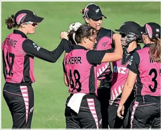  ??  ?? The pink White Ferns uniform of today is vastly different to what women wore in the early years of cricket in New Zealand.