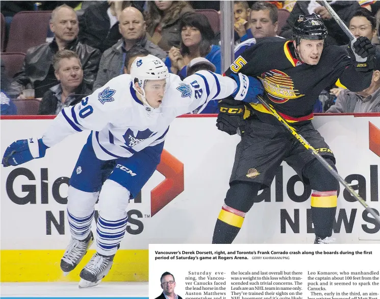  ?? GERRY KAHRMANN/PNG ?? Vancouver’s Derek Dorsett, right, and Toronto’s Frank Corrado crash along the boards during the first period of Saturday’s game at Rogers Arena.
ED WILLES