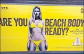  ??  ?? This is a file photo from April of an advert at an undergroun­d station in London. Mayor Sadiq Khan has banned advertisin­g that promotes unhealthy body images on the subway.