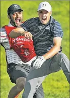  ?? Getty Images ?? BUMP & FUN: Jordan Spieth (right) jumps for joy with his caddy after sinking a chip to win the Travelers Championsh­ip on Sunday.