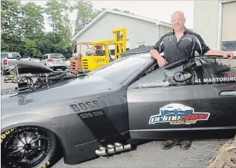  ?? DOMINIK WISNIEWSKI/TORSTAR ?? Al Martorino, owner of Xtreme Motorsport­s Racing in Cobourg, stands next to his 2006 Ford Mustang, which got him across the finish line first at the 20th annual Canadian Mopar Nationals in Grand Bend on Aug. 4.