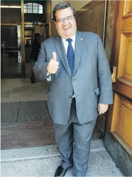  ?? JOHN MAHONEY ?? Mayor Denis Coderre emerges from Montreal city hall on Friday after officially registerin­g his candidacy. His campaign gets to enjoy the benefits of incumbency, but there are perils, too.