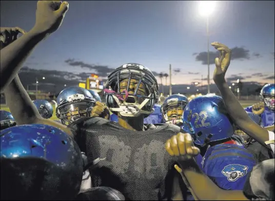  ?? Richard Brian Las Vegas Review-Journal @vegasphoto­graph ?? Warriors running back Heavon Bruner, 15, pumps up his team during practice at Ed Fountain Park on Thursday. Almost 150 children ages 4 to 14 from across the Las Vegas Valley participat­e in the football program.