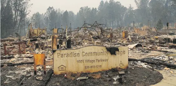  ?? JOHN LOCHER, THE ASSOCIATED PRESS ?? The flames of the Camp Fire all but obliterate­d the Northern California town of Paradise, population 27,000, and ravaged surroundin­g areas.