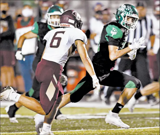  ?? JOHN SMIERCIAK/POST-TRIBUNE PHOTOS ?? Valparaiso’s Tommy Burbee, right, heads to the end zone on one of his three touchdown runs during Friday’s game against visiting Chesterton.