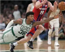  ?? MATT STONE / HERALD STAFF ?? FALLING FLAT: Celtics guard Marcus Smart tries to tip a pass on Wednesday night against the Detroit Pistons.