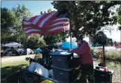  ??  ?? Lawrence “Blue” McGregor organizes his campsite at San Lorenzo Park on Friday. McGregor is a proud crew leader of the Downtown Streets Team.