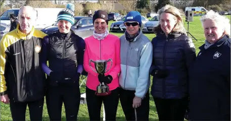  ??  ?? Micheal Mulligan (Louth chairman) and Georgina Drumm (President, Athletics Ireland) make the presentati­on for the ladies race to Dunleer AC’s Aoife Fay, Nicola Welsh, Karen Costello and Nicola Courtney.