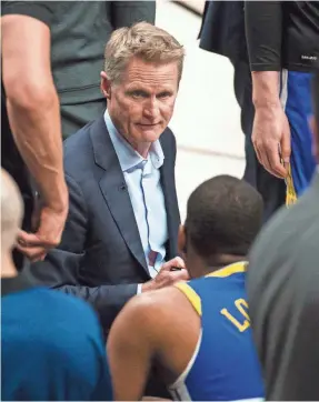  ?? TROY WAYRYNEN/USA TODAY SPORTS ?? Warriors head coach Steve Kerr talks to his players during a timeout against the Trail Blazers.