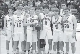  ?? Photo by Becky Polaski ?? Members of the Elk County Catholic Crusaders are shown with their D9 1A boys’ championsh­ip plaque and medals following their win over Union on Saturday.