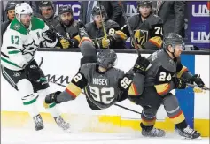  ?? John Locher The Associated Press ?? Golden Knights left wing Tomas Nosek falls to the ice between Dallas Stars right wing Alexander Radulov and Vegas center Oscar Lindberg in the second period Sunday at T-mobile Arena.