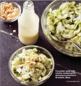  ?? — The Associated Press ?? Cucumber salad with creamy roasted garlic dressing is pictured in Brookline, Mass.