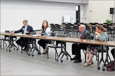  ??  ?? Local officials gathered with a team appointed by the state to assess the Polk County College and Career Academy in late March.