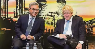  ??  ?? In good hands: Liew having a discussion with former London mayor Boris Johnson. Liew says he has confidence UK government will move the country forward on every front.