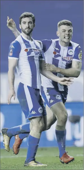  ?? PICTURE: PA. ?? DREAMLAND: Will Grigg’s second-half strike secured a stunning 1-0 victory for Wigan which sent 10-man Manchester City crashing out of the FA Cup last night. Fabian Delph’s dismissal on the stroke of half-time did little to stem the flow of City attacks...