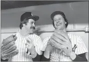  ?? HARRY HARRIS/THE ASSOCIATED PRESS, FILE ?? New York Yankee hurlers Jim Catfish Hunter, left, and Ken Holtzman are all smiles prior to the start of Game 2of the American League Championsh­ip Series against the Kansas City Royals on Oct. 6, 1977, in New York.