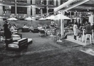  ?? Photos by Dylan Scardino ?? The patio’s green space is outfitted with lounge furniture.