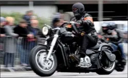  ?? FABIAN BIMMER / REUTERS ?? A biker rides his Harley-Davidson during a “Hamburg Harley Days” parade in Hamburg, Germany on Monday.