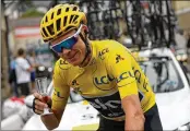  ?? CHRIS GRAYTHEN / GETTY IMAGES ?? Chris Froome of Great Britain celebrates his fourth Tour de France victory with champagne last year. With one more Tour victory, Froome would match the record of five shared by four cyclists.