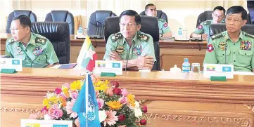  ??  ?? Min Aung Hlaing (centre) addresses members of the United Nations Security Council at Bayint Naung villa in Naypyidaw, Myanmar. — Reuters photo