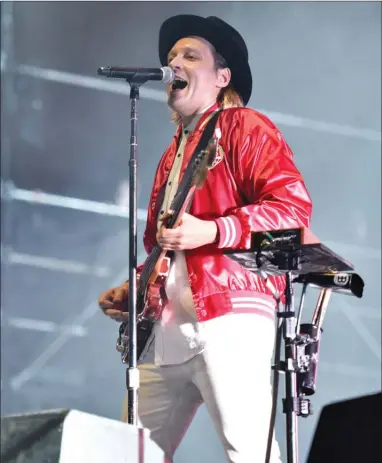  ?? ROB GRABOWSKI/The Canadian Press ?? Win Butler of Arcade Fire performs in Chicago. Arcade Fire and Jessie Reyez are the leading nominees at this year’s Juno Awards in Vancouver. Arcade Fire is in the running for best group, single, album and alternativ­e album.