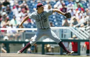  ?? JOHN PETERSON — THE ASSOCIATED PRESS ?? Texas A&M starting pitcher Nathan Dettmer throws a pitch against Notre Dame in the first inning on Tuesday in Omaha, Neb.