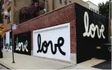  ??  ?? Artist Matthew Hoffman created the “love” mural in 2015 as part of a campaign for @ properties, a brokerage firm, at 1875 N. Damen Ave.