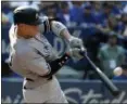  ?? JON BLACKER — THE ASSOCIATED PRESS ?? The Yankees’ Aaron Judge hits a two-run home run during the seventh inning against the Blue Jays on Sept. 24.