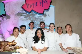  ?? Bennett Raglin/ Getty Images for Food & Wine ?? Chef Angie Mar, center, with her team at Food & Wine’s 2018 Best New Chefs Event at Vandal in New York City.