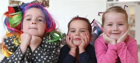  ??  ?? Above: Daisy, Fern and Savannah having lots of fun in school on Friday as the kids from St. Oliver’s NS had a crazy hair day to raise funds for SVP.