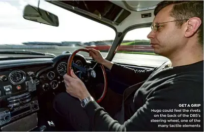  ??  ?? GET A GRIP Hugo could feel the rivets on the back of the DB5’s steering wheel, one of the many tactile elements