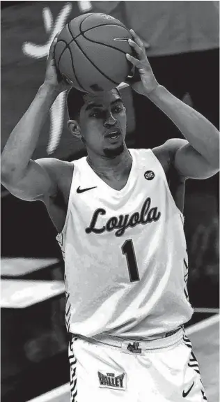  ?? JEFF ROBERSON / AP ?? Loyola’s Lucas Williamson looks to pass during the second half of the Ramblers’ Missouri Valley Conference Tournament semifinal against Indiana State on Saturday in St. Louis.