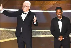  ??  ?? In the absence of a host, comedians Steve Martin (left) and Chris Rock delivered an opening monologue, saying they hoped there would not be a repeat of the envelope mix-up of 2017