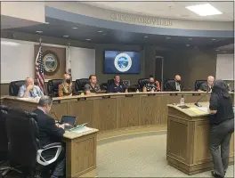  ?? JUSTIN COUCHOT/MERCURY-REGISTER ?? From left to right, Oroville City Attorney Scott Huber, councilors Art Hatley, Krysi Riggs, Scott Thomson, Chuck Reynolds, Janet Goodson, Eric Smith and David Pittman listen as Oroville Assistant City Administra­tor for Administra­tive Service Ruth Wright speaks Tuesday to the City Council about Oroville’s financial analysis for the fiscal year which began June 30at the Oroville City Council meeting in Oroville.